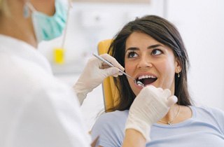 A young woman about to receive treatment for gum disease