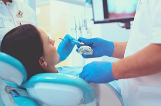 Lady smiles at dentist