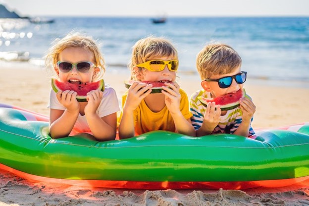 Children enjoying summer on the beach.